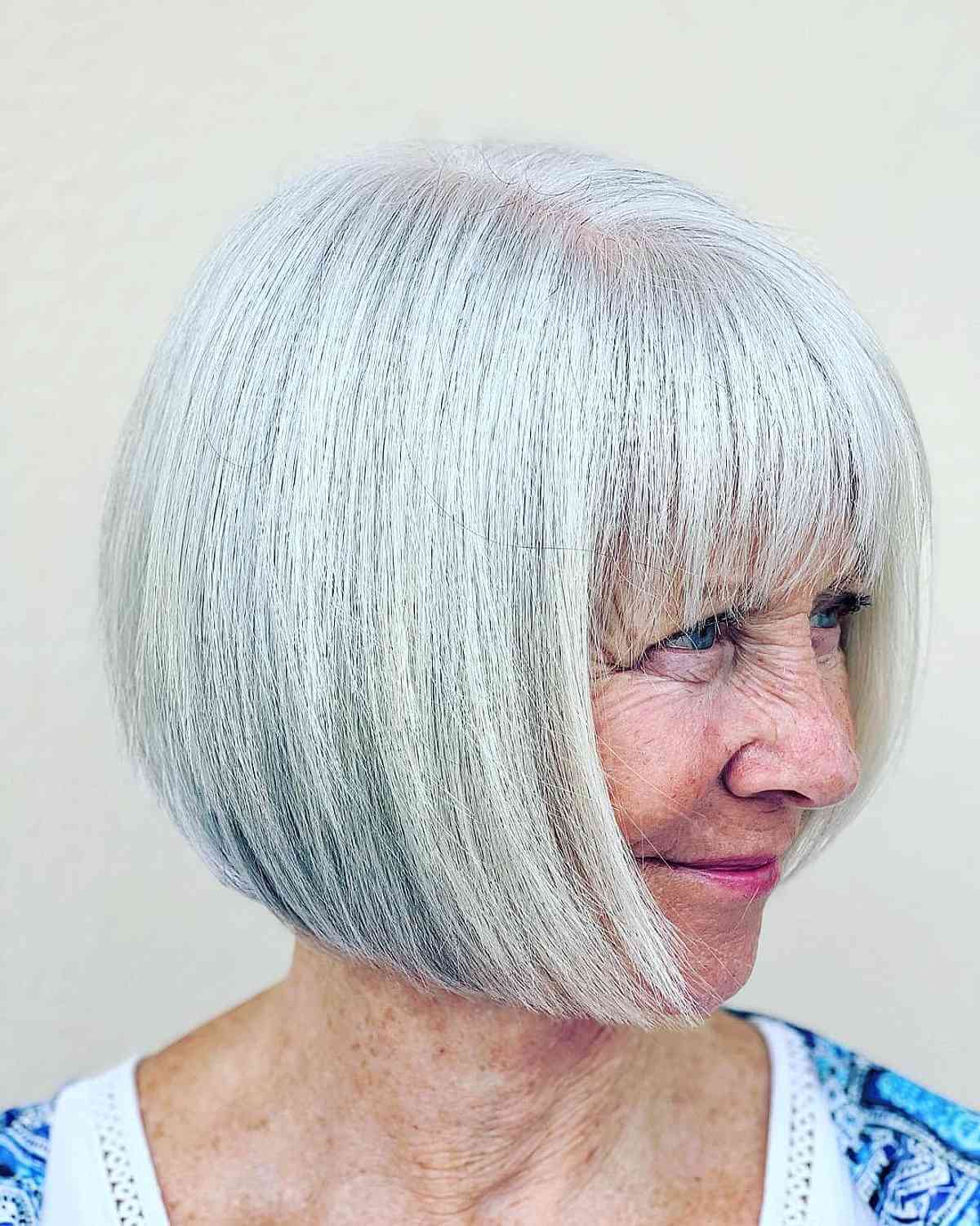 chin length bob haircut with full bangs for women seventy and over