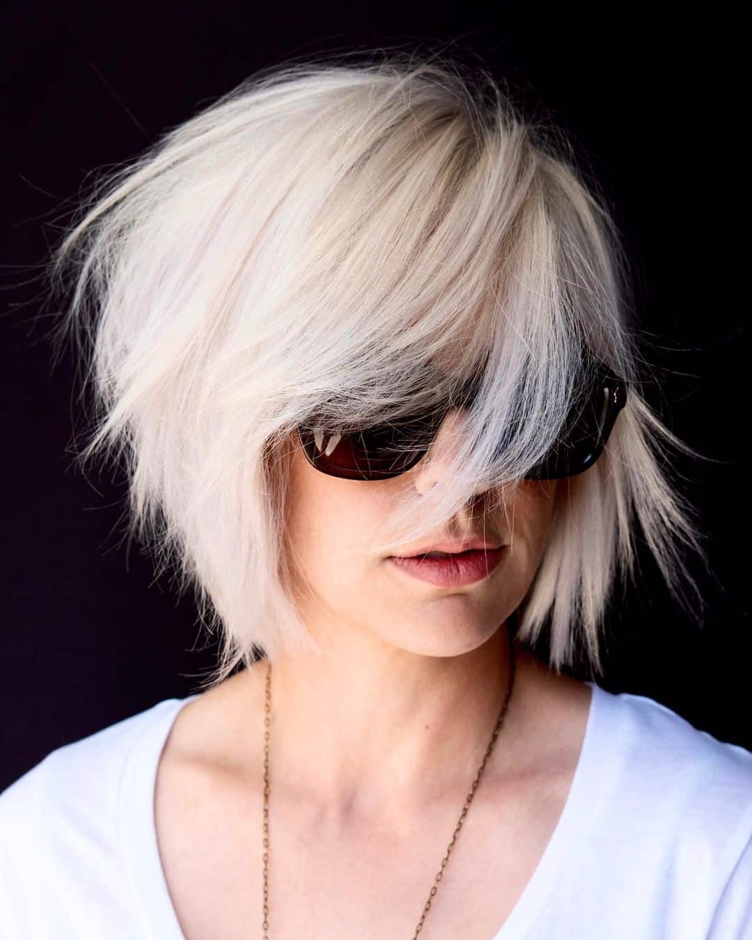 chin length bob with layers and swoop bangs