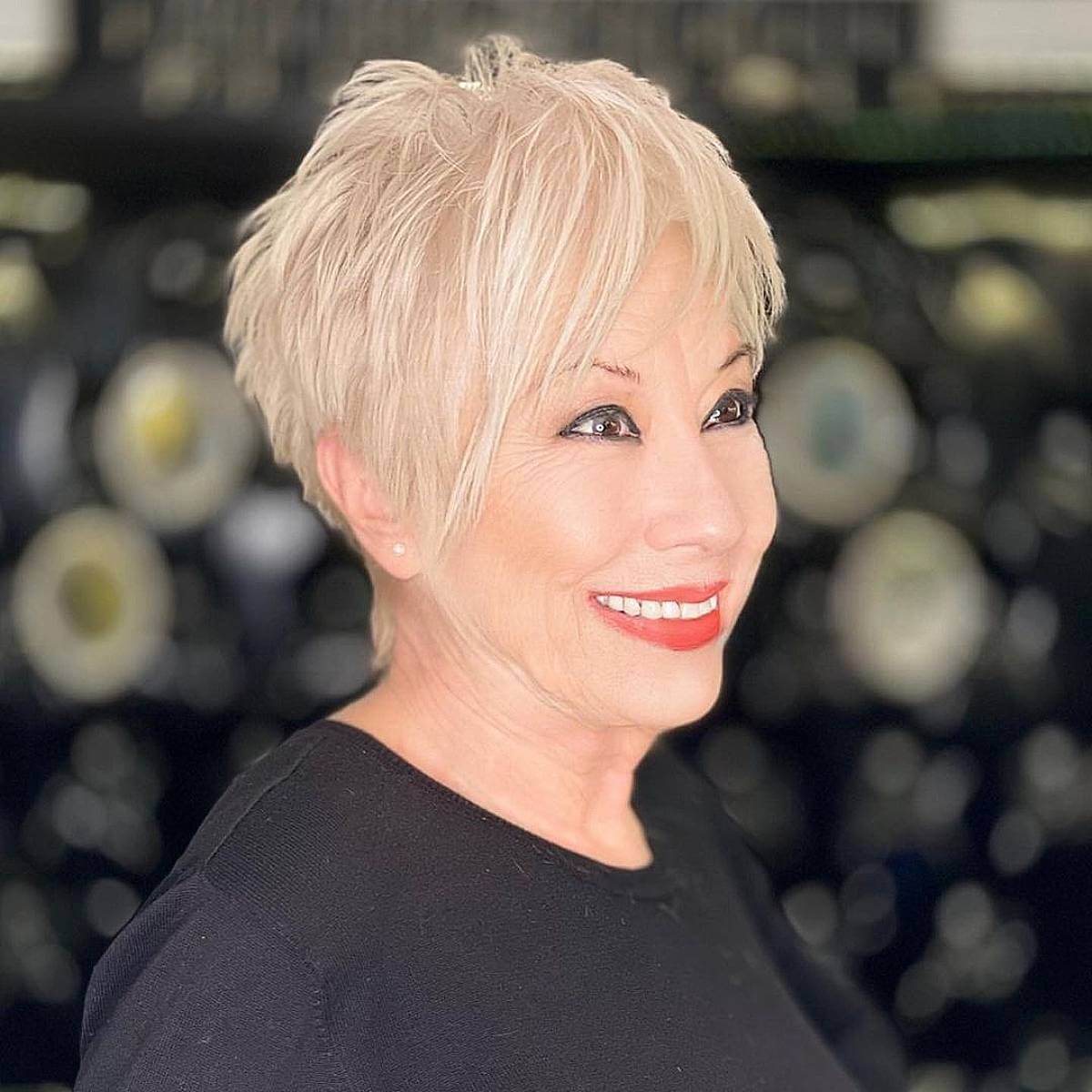 choppy cropped cut with long bangs for ladies in their 70s