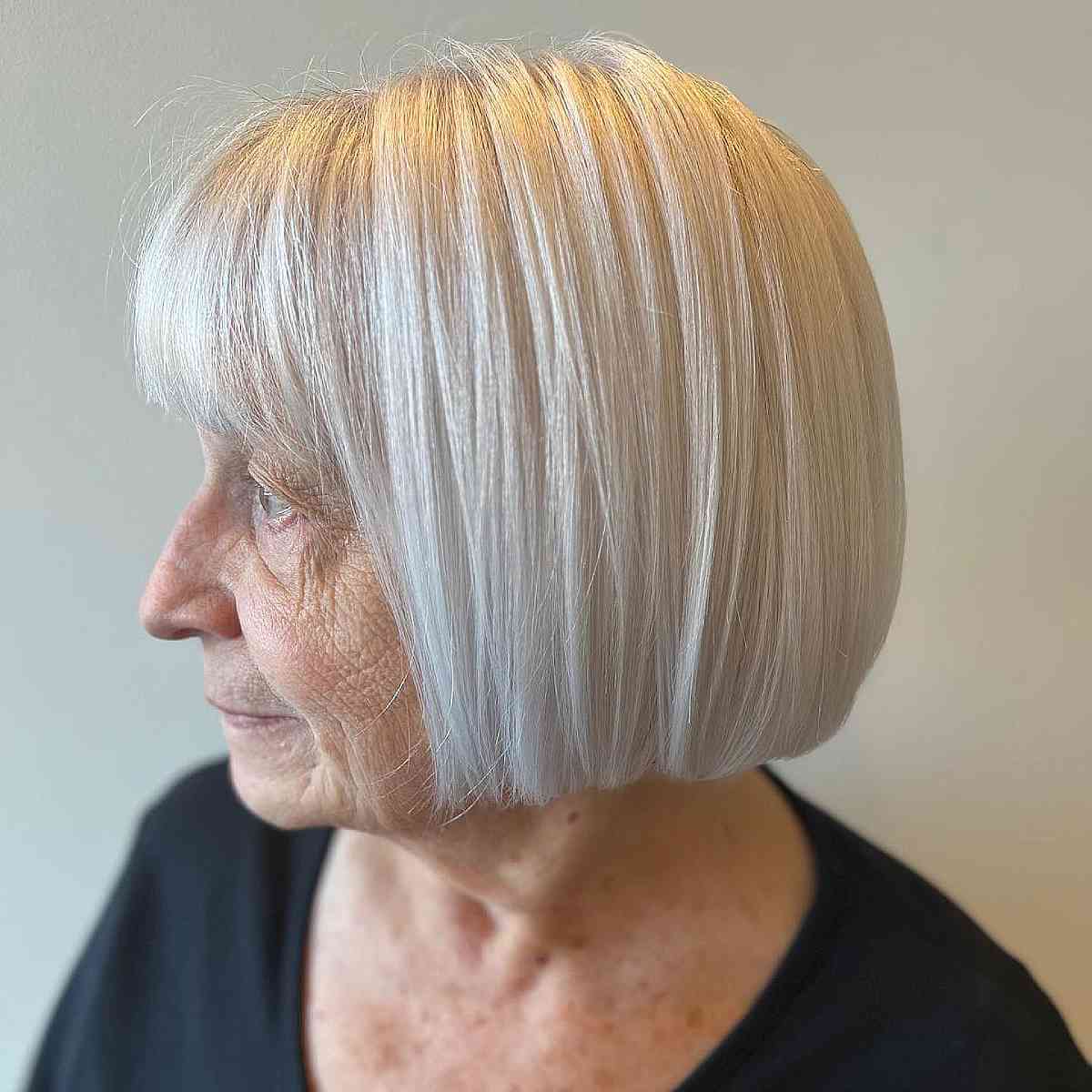 classic blunt cut bob for ladies over 70 with white hair