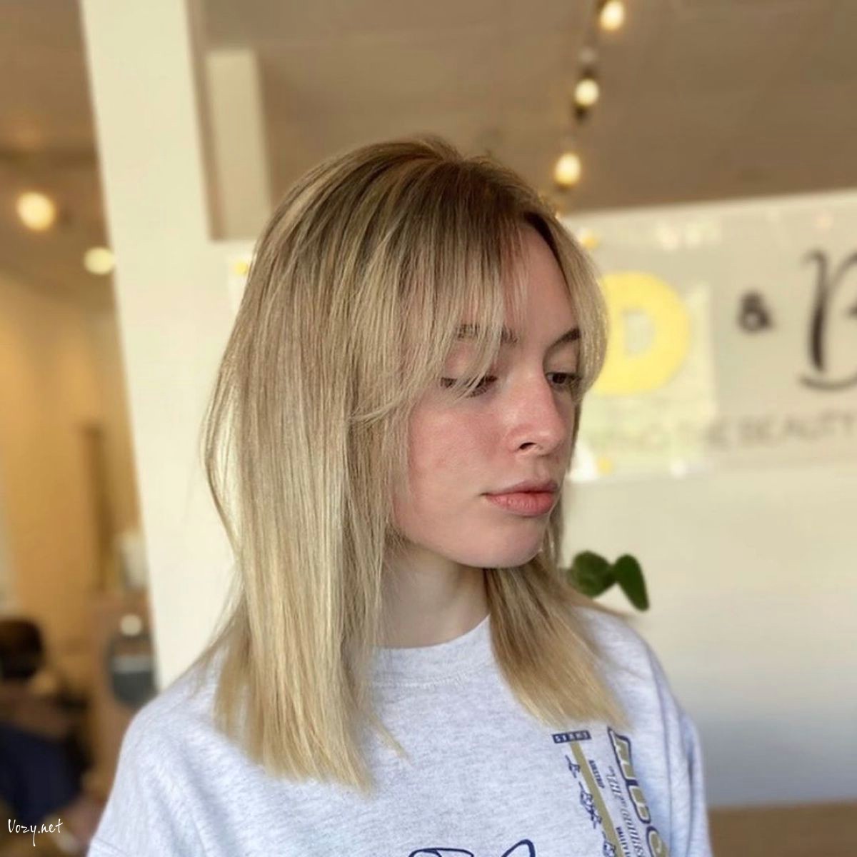 collarbone length blunt cut with curtain bangs