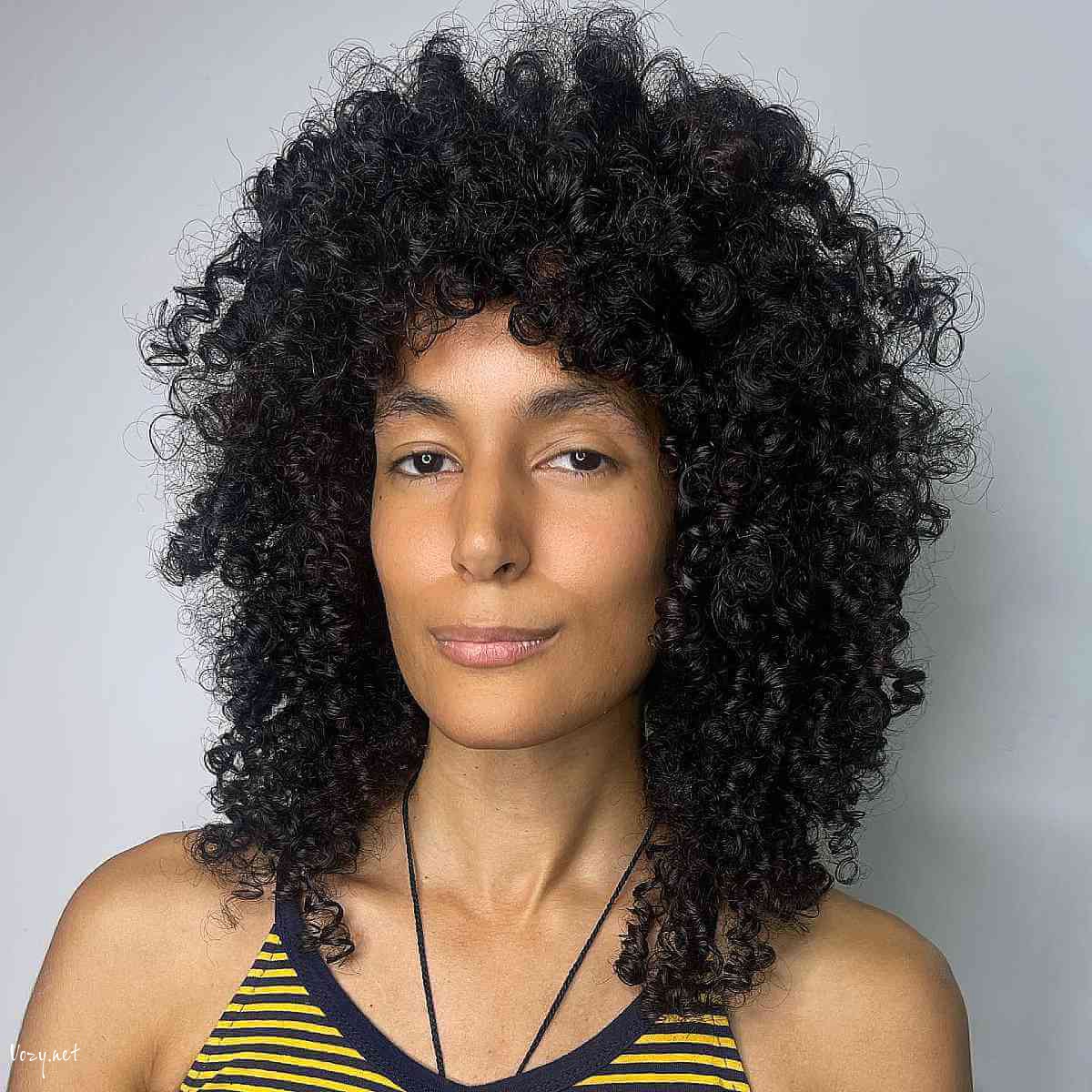 collarbone length curly shag
