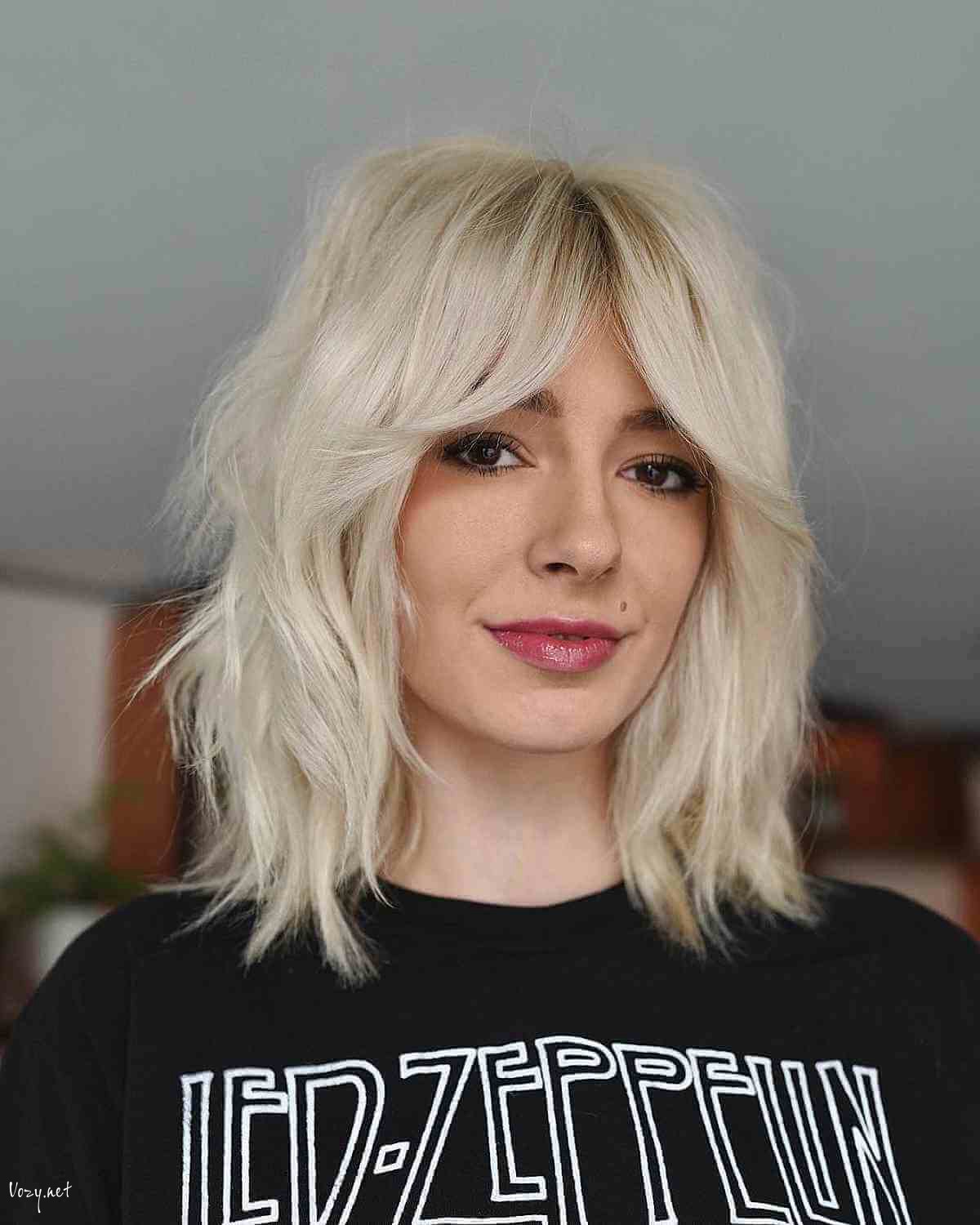 cool platinum undone shag with curtain bangs