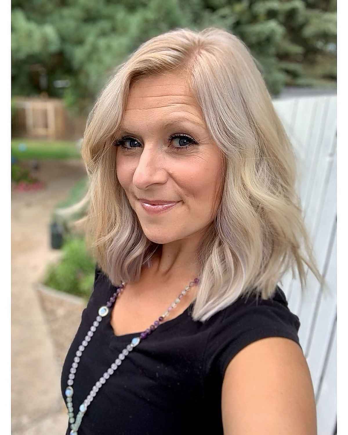 cool soft blonde highlights hairstyle for ladies over 50