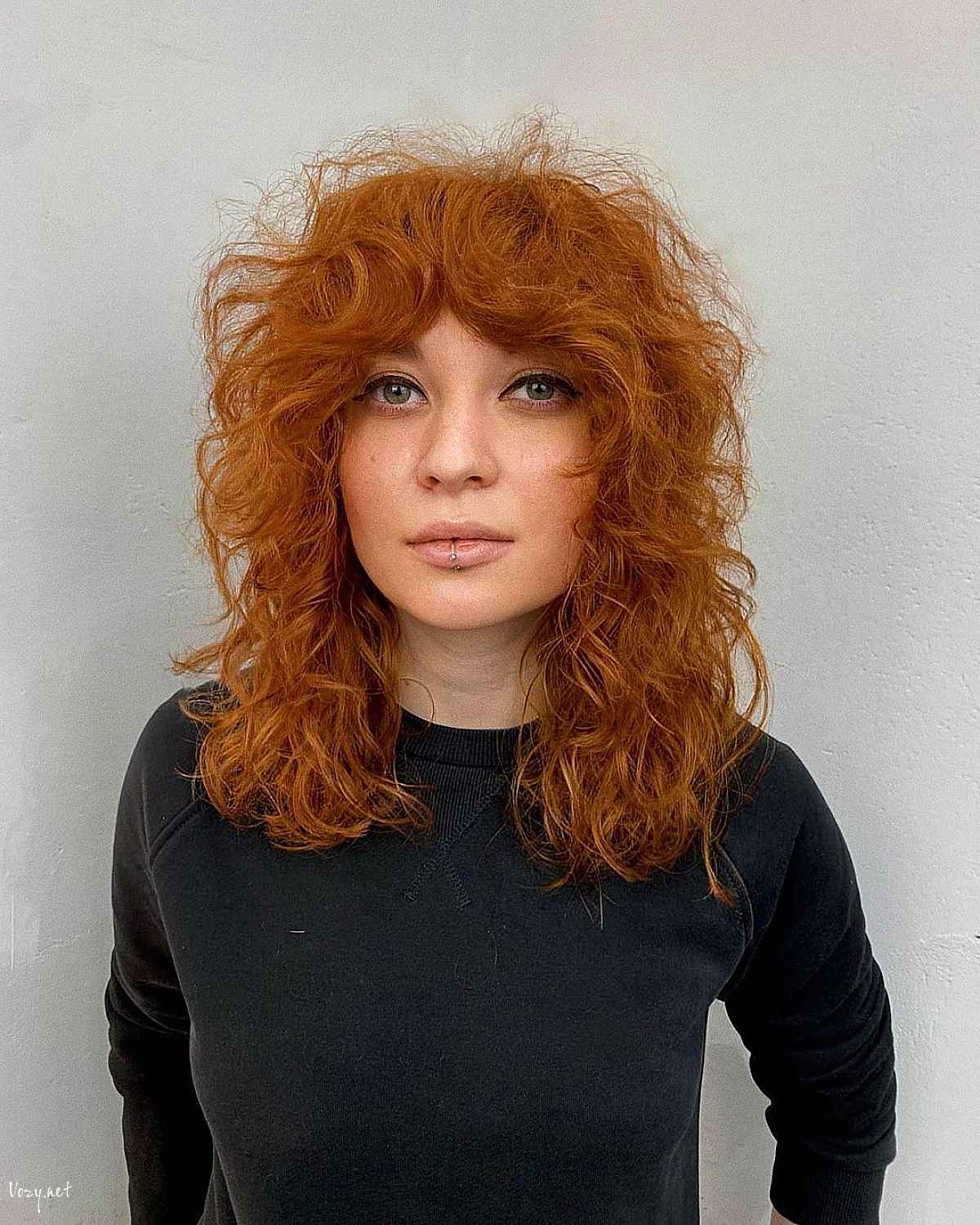 curly and wavy shag with curtain bangs