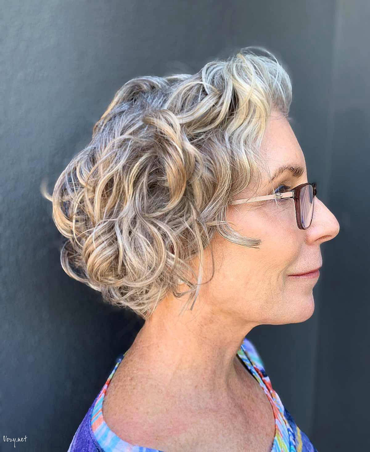 curly hairstyle for women over 50 with glasses