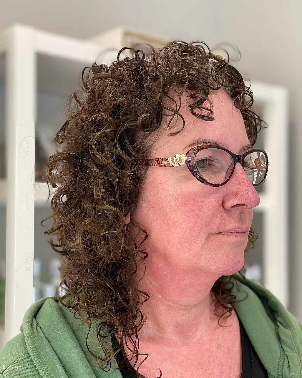 curly shag for women over 60 with glasses