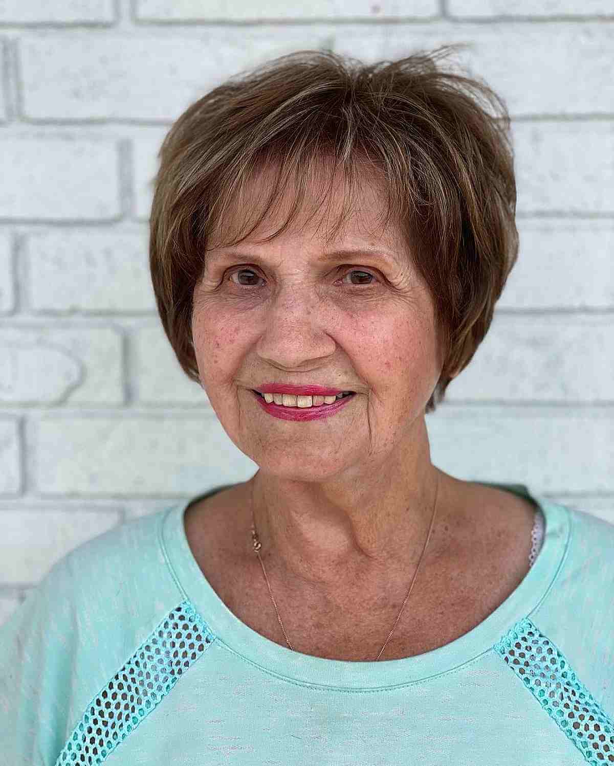 cute short bob with wispy bangs for ladies over seventy