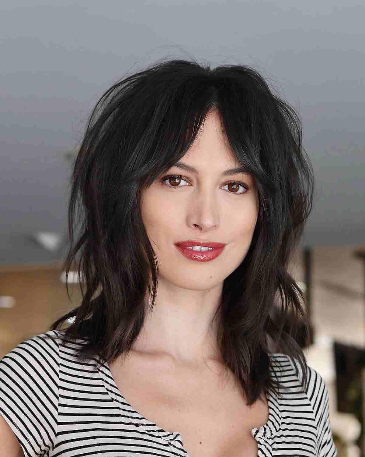 dark shoulder length hair with curtain bangs