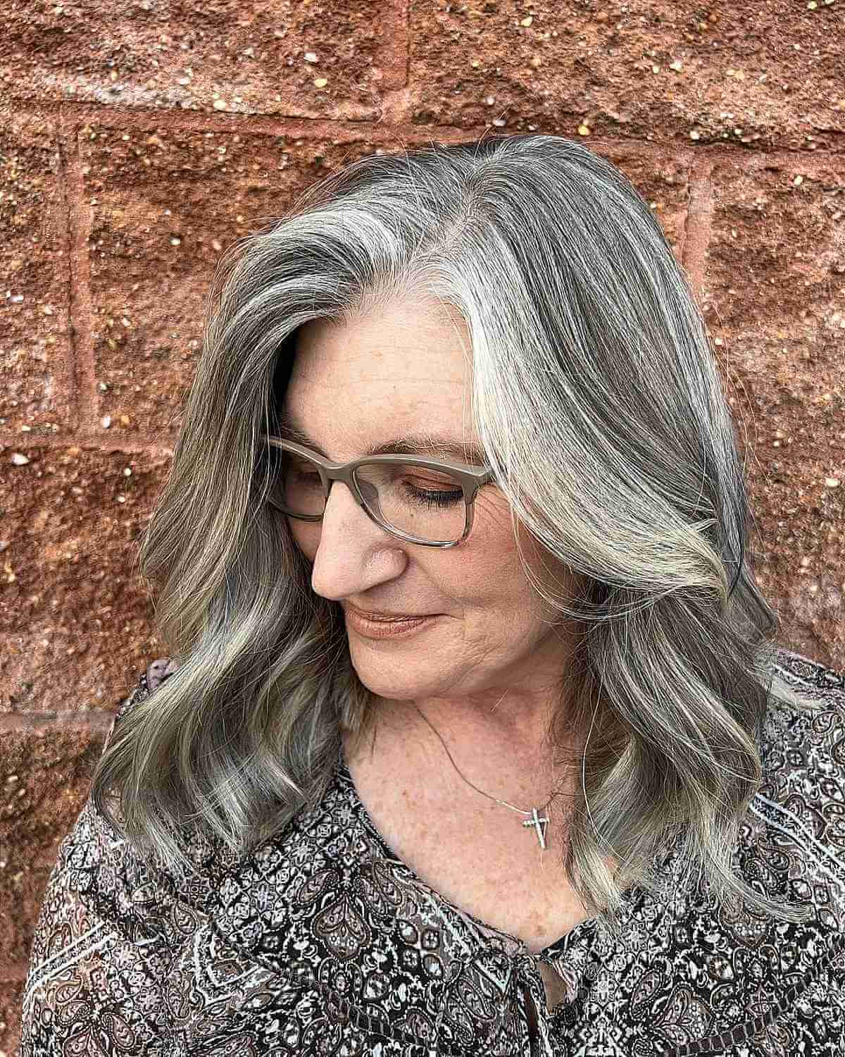 dimensional medium length grey hair with loose waves for old women