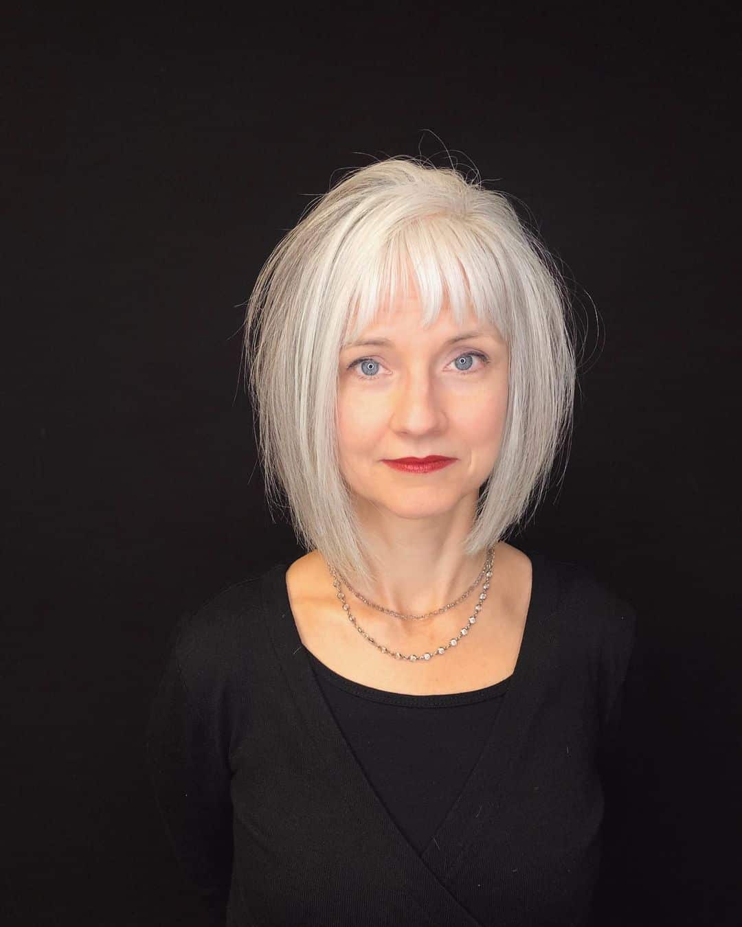 edgy asymmetrical bob haircut for older ladies