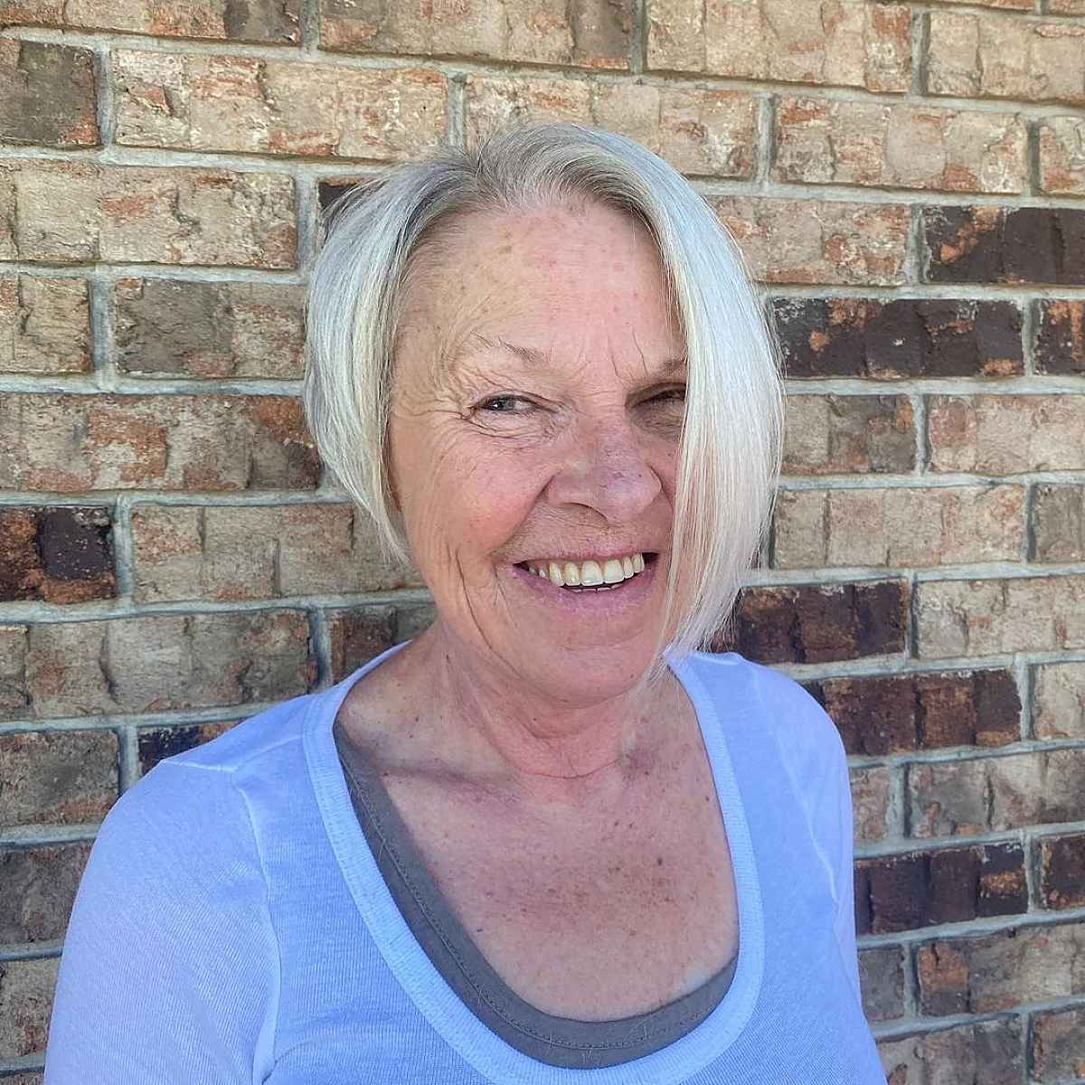 edgy asymmetrical layered bob for ladies passed 60