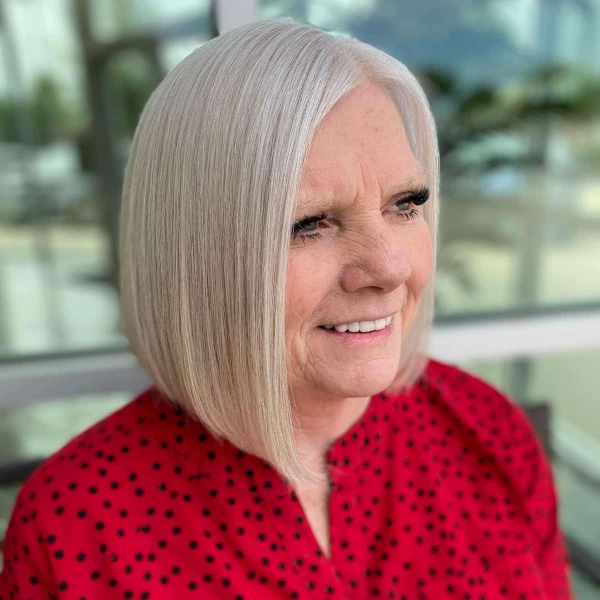 edgy asymmetrical lob for over 60 with straight hair
