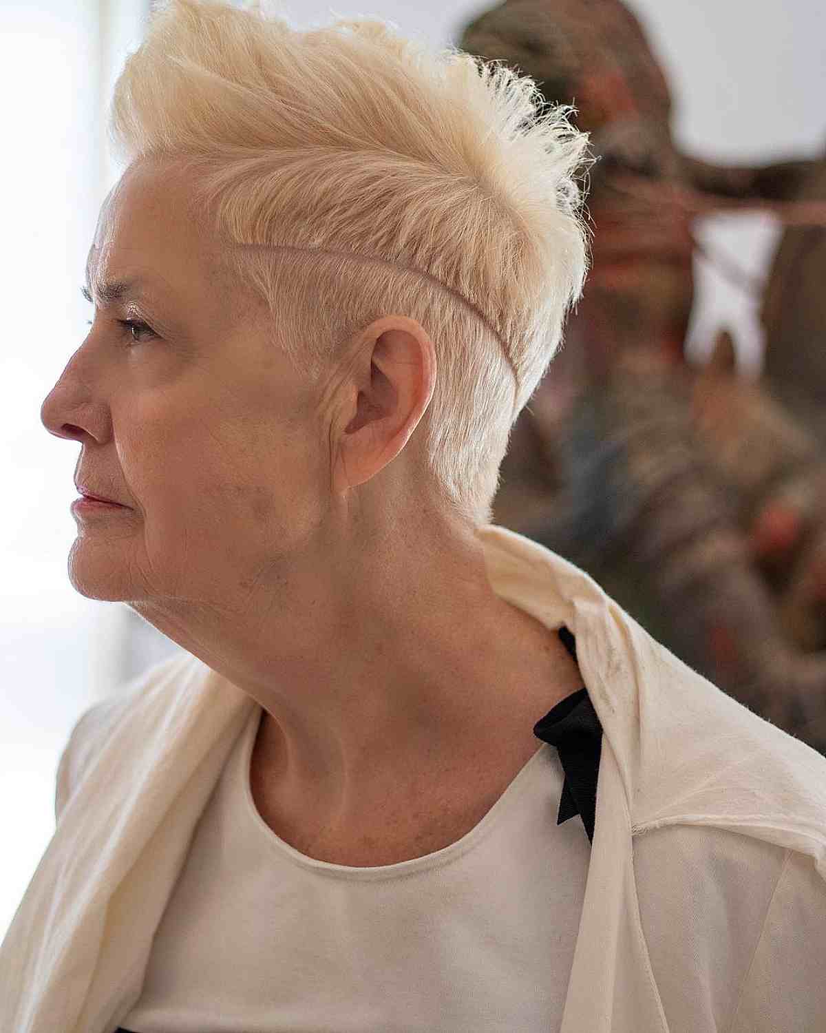 edgy pixie with hard part and undercut