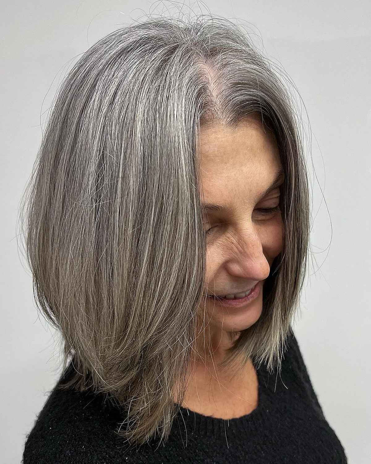 face framing medium bob on grey hair for women past their 60s