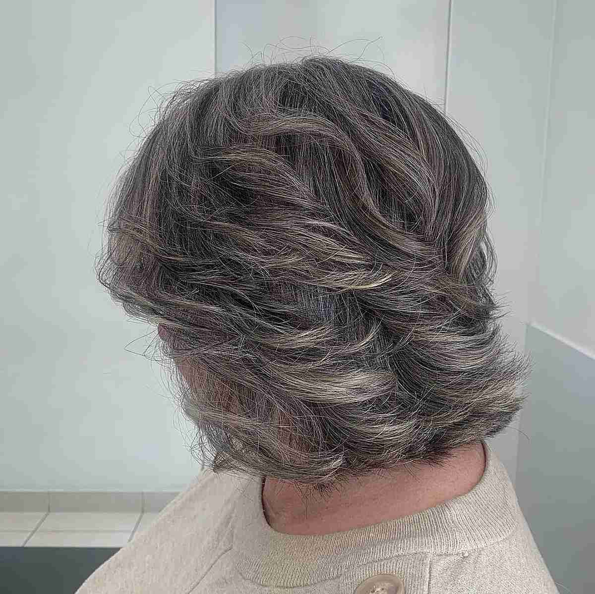 feathered grey bob with v cut layers for old women