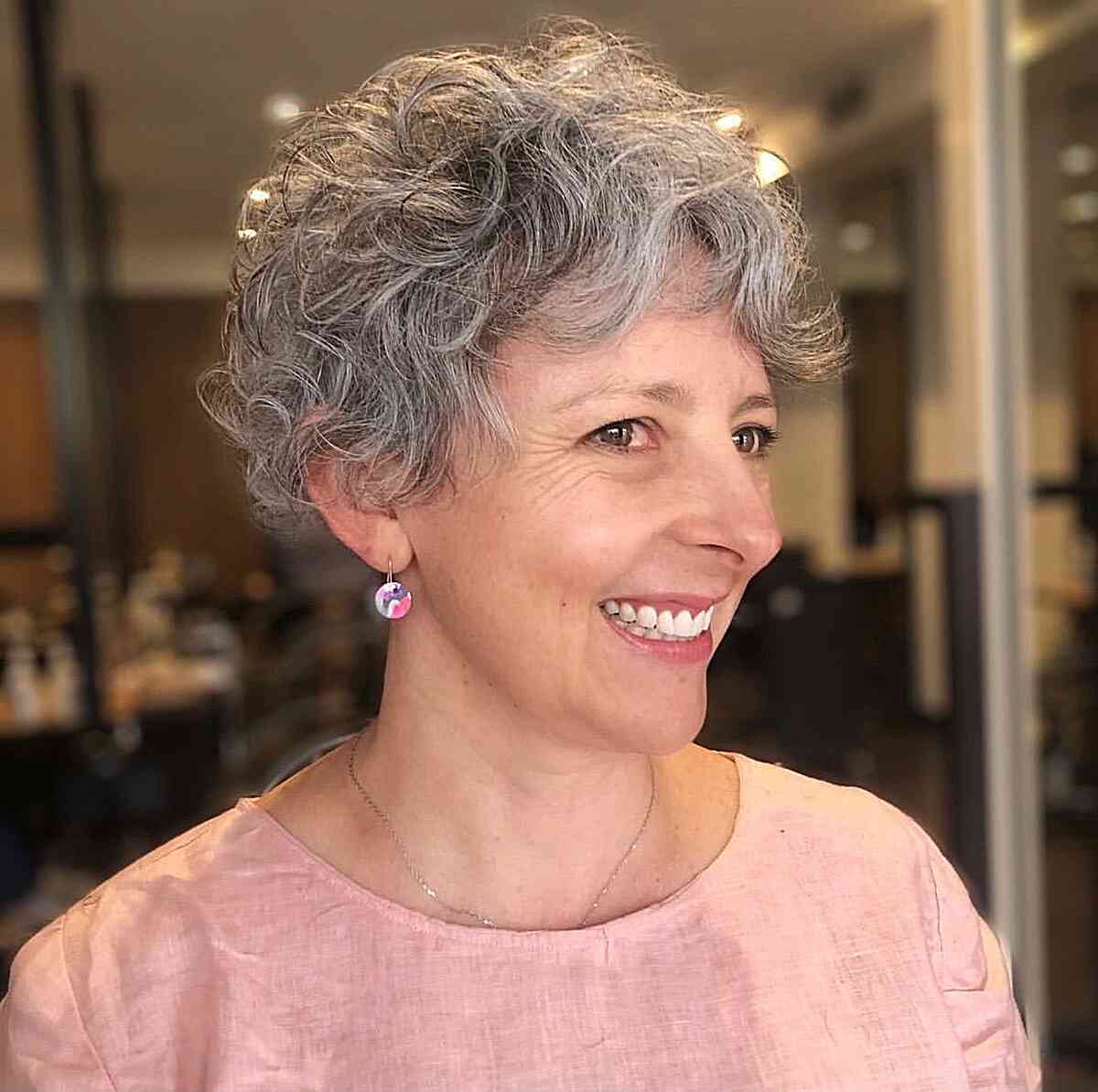 fluffy silver pixie on natural curls for ladies over 50