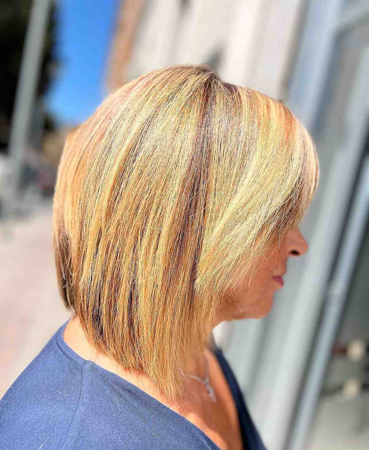 glossy blonde bob with layers for women over sixty