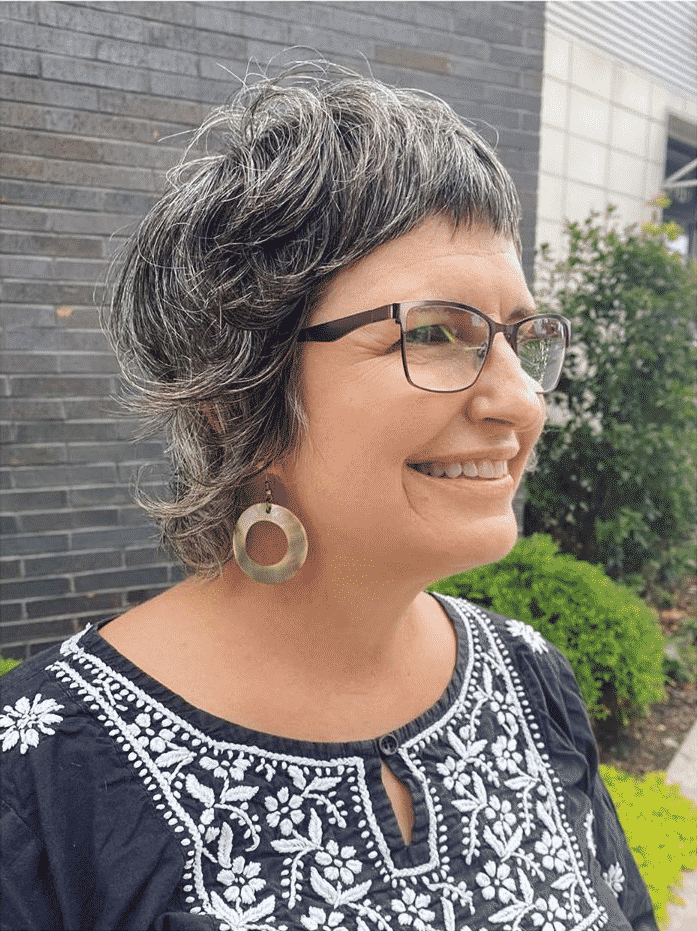 grey razor cut shag with glasses women over 50