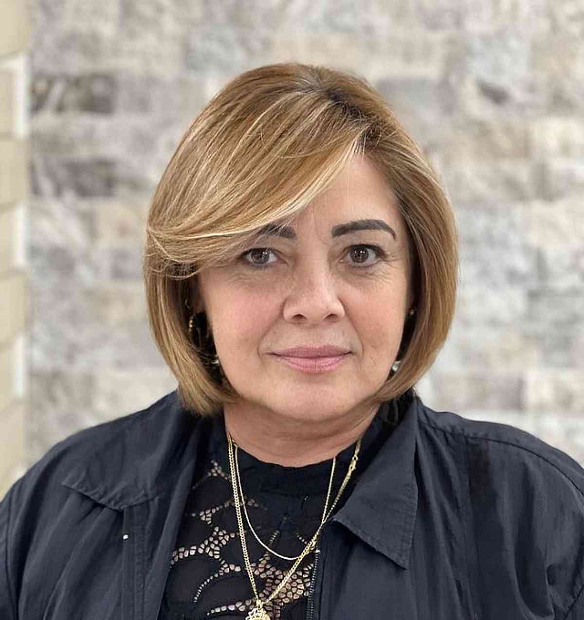 jaw length cut with long side swept bangs ladies over 50