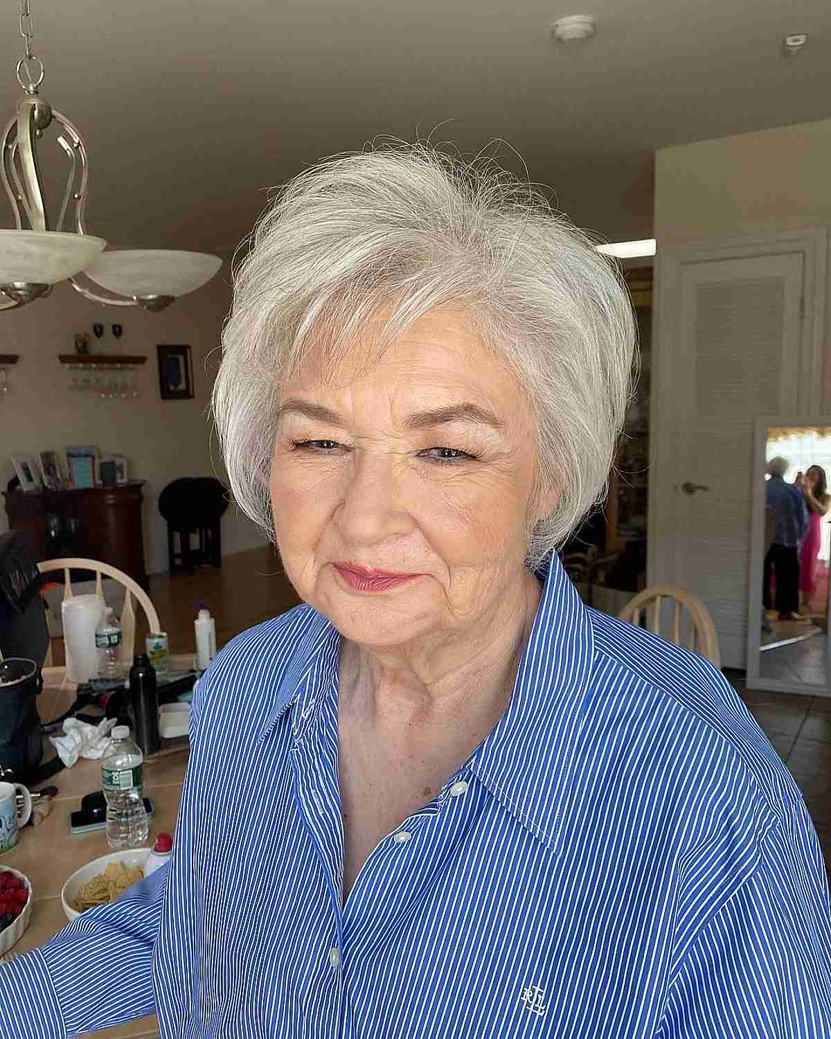 jaw length white hairstyle with a side part for women 70 and over