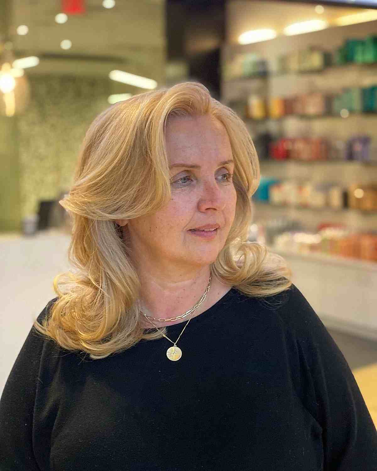 layered blowout style with a deep side part for older women