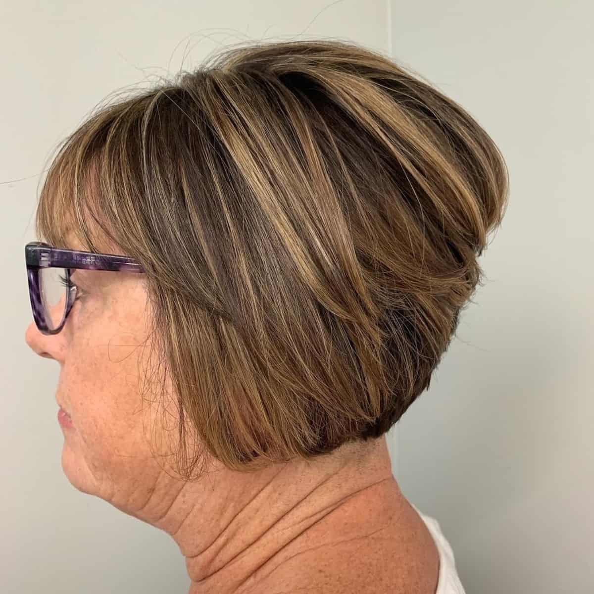 layered bob for older women passed 70 with large frames