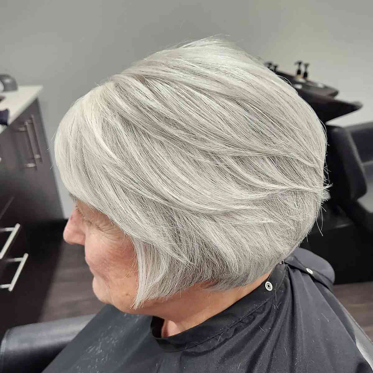 layered bob with natural color for a woman over 60