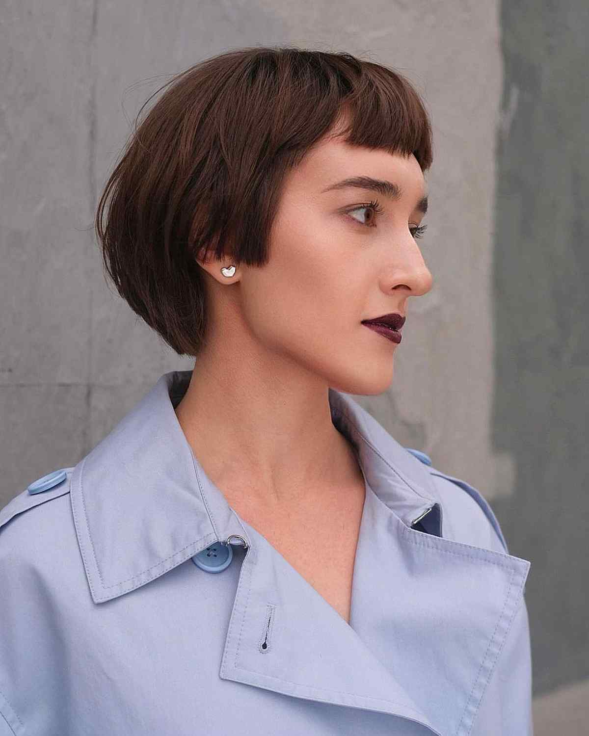 layered brunette bob with thick micro bangs