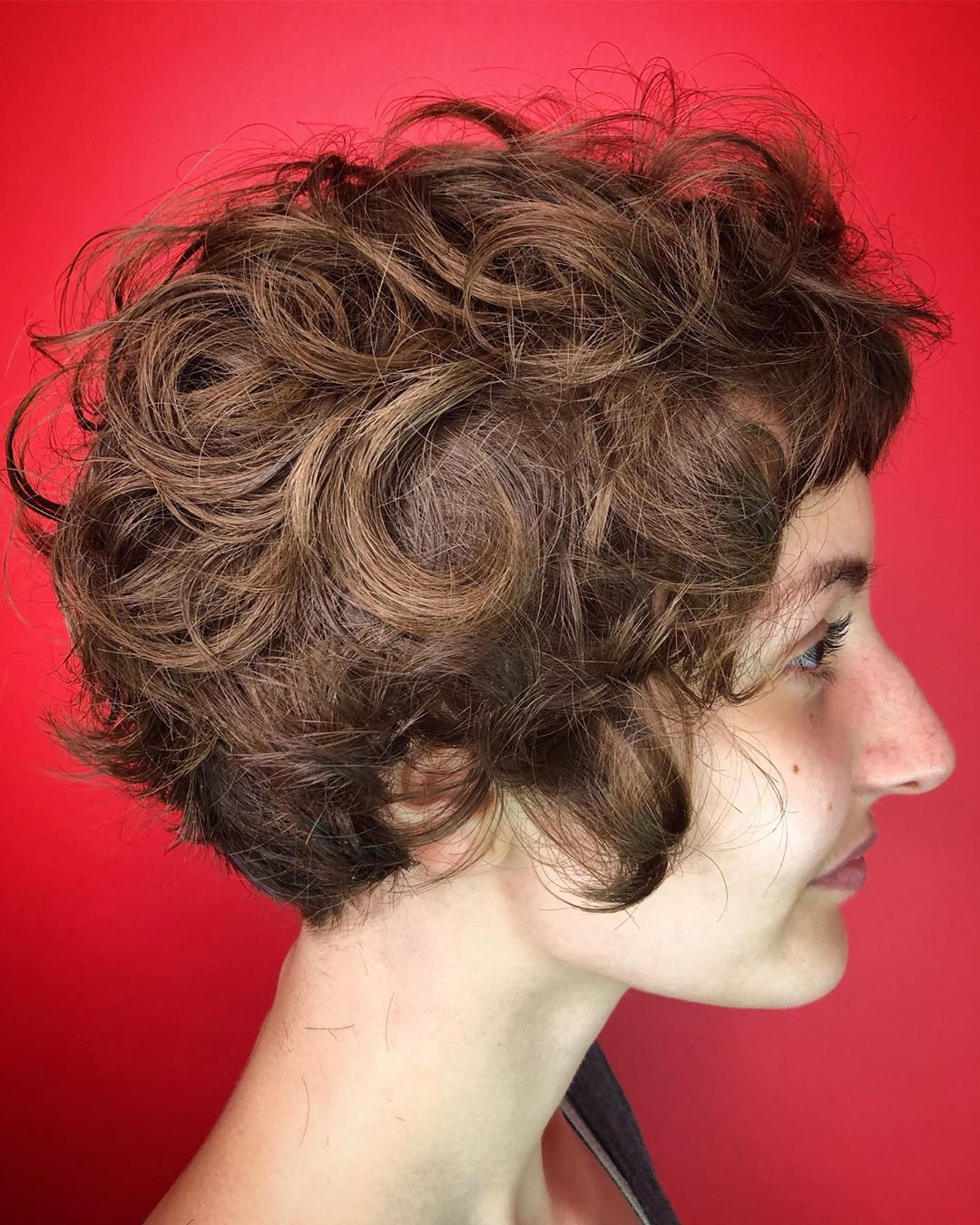 layered curly bob with bangs 1 1