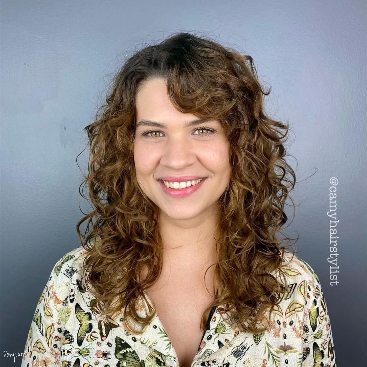 layered curly locks with side bangs