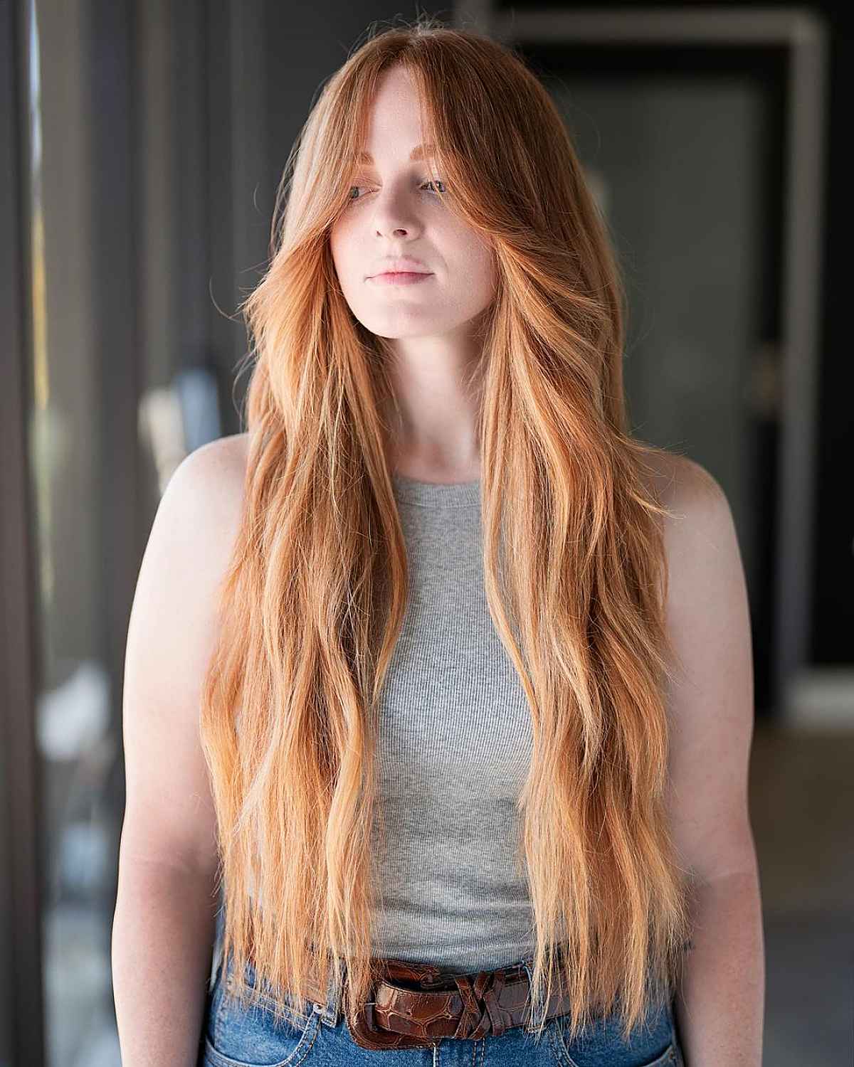 layered hair with long curtain bangs