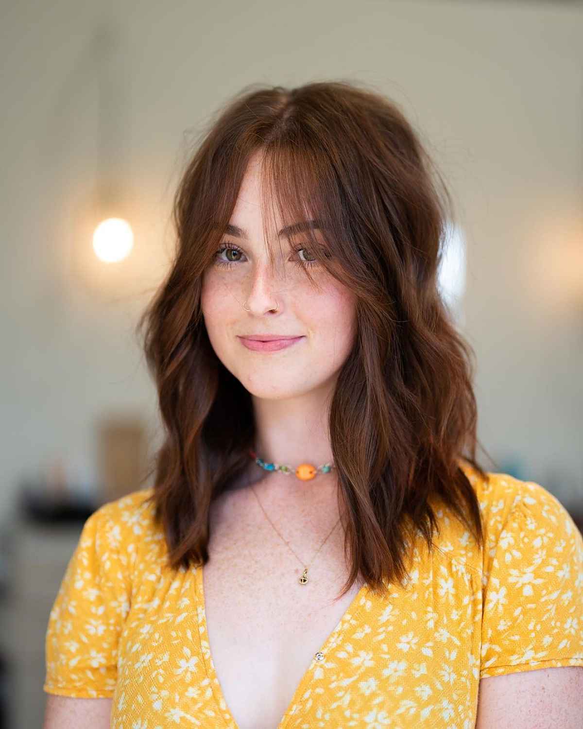 layered hairstyle with curtain fringe