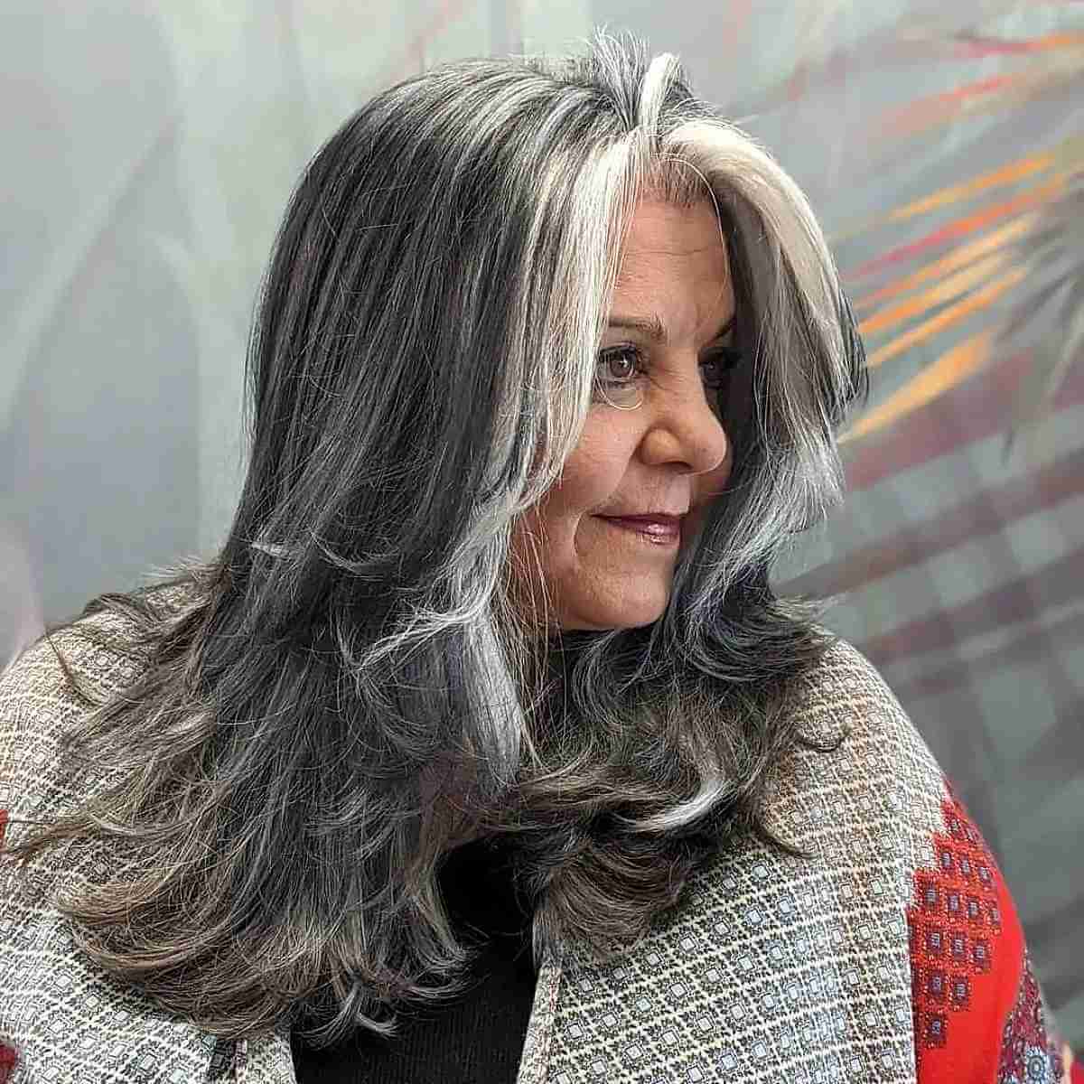 layered hairstyle with money pieces for a woman in her 70s