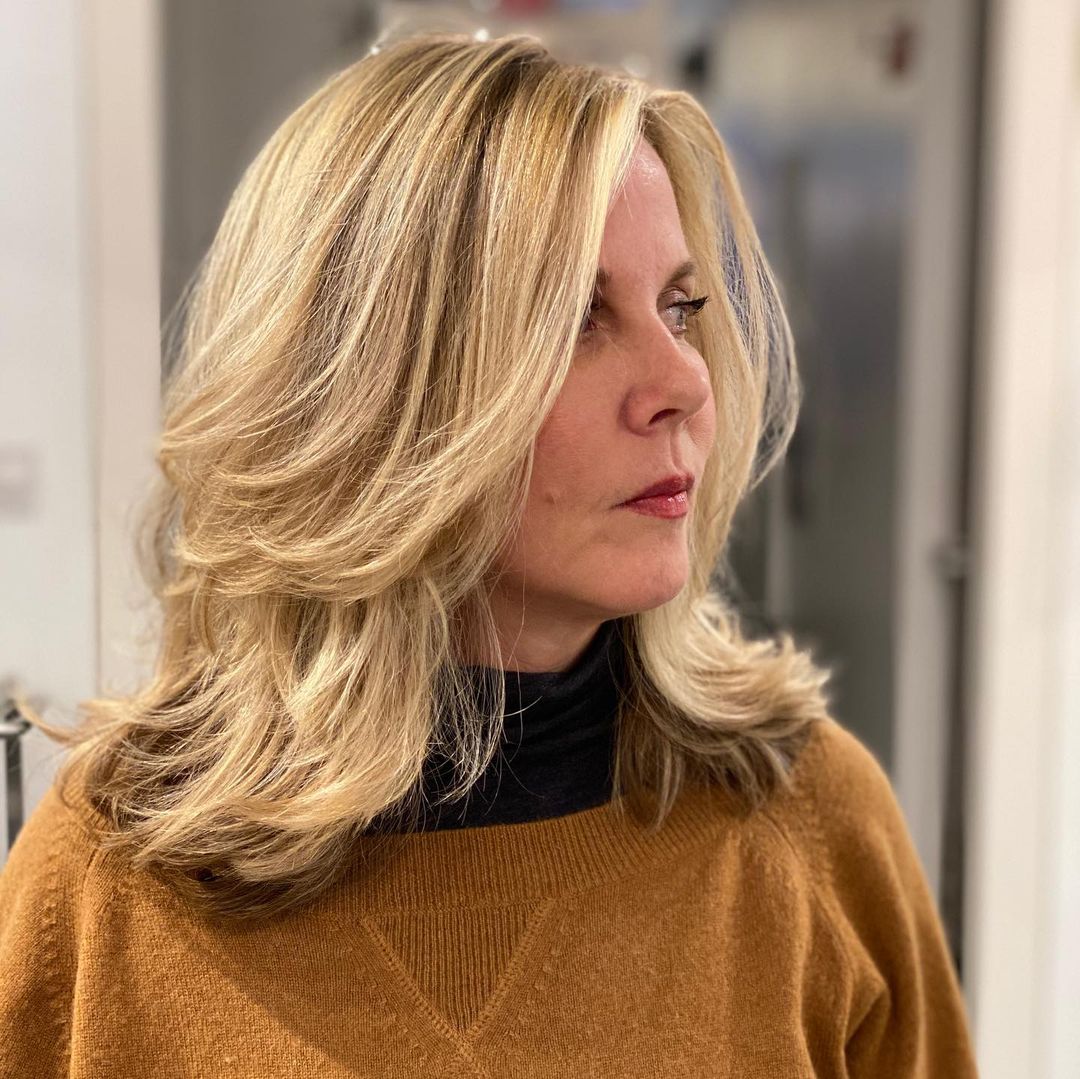 layered mid length cut for women over 50