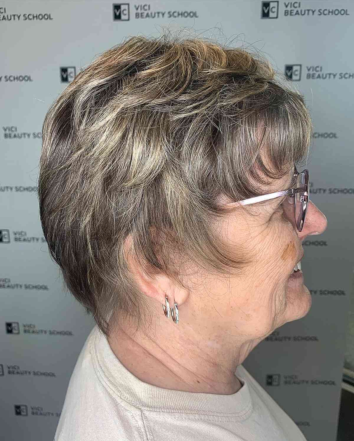 layered pixie for older women over seventy with glasses