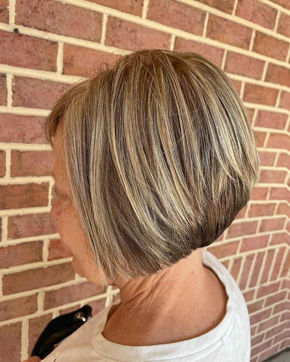 layered stacked bob with balayage for sixty year olds