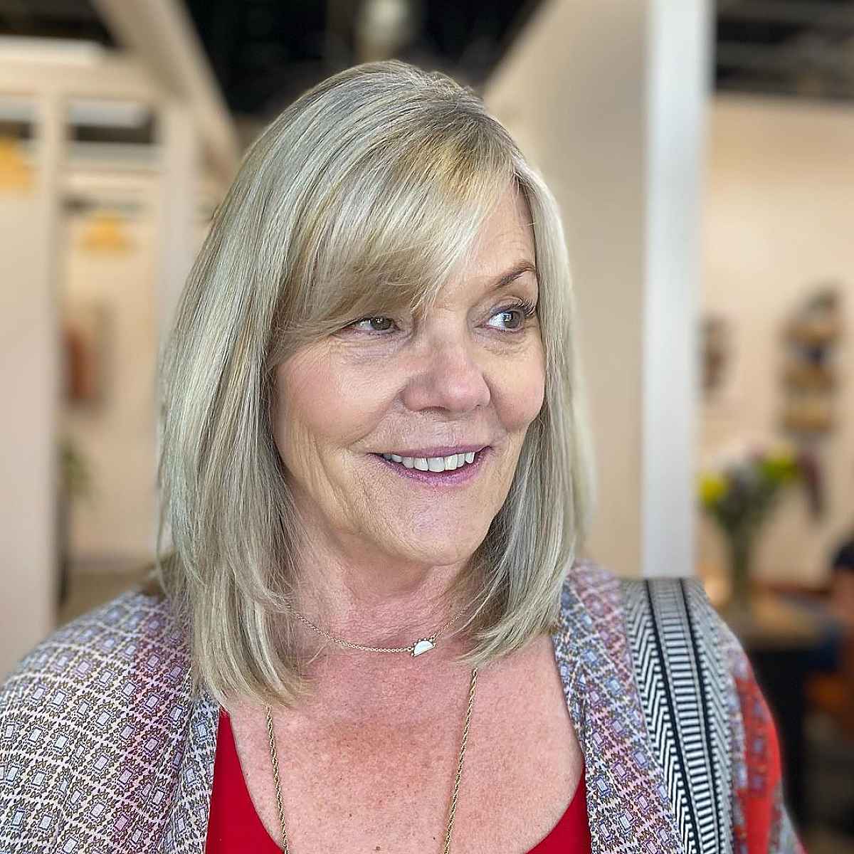 long bob with long layers for a woman in her 60s