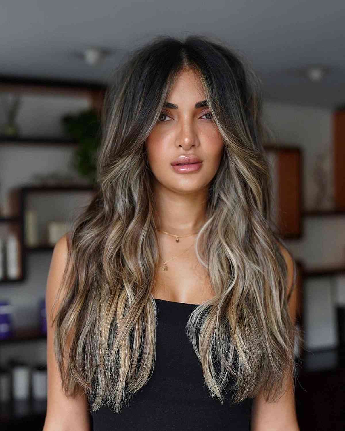 long curtain bangs with seamless layers and balayage