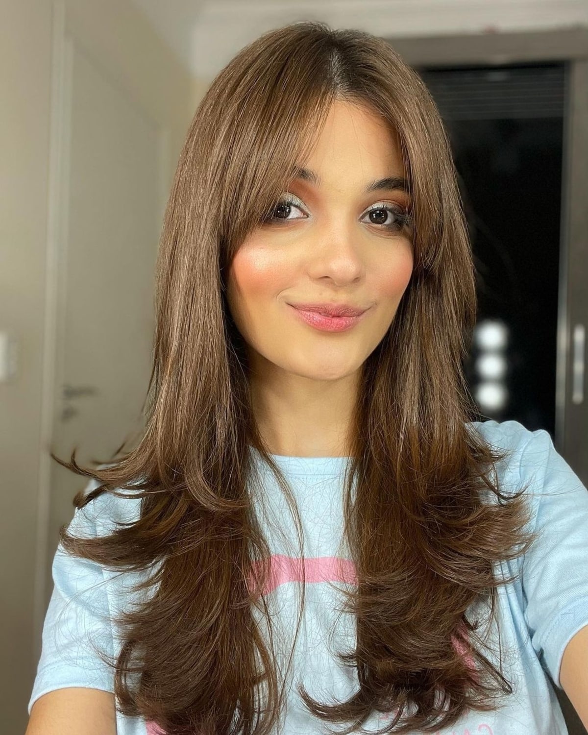 long hair with a middle part and curtain bangs