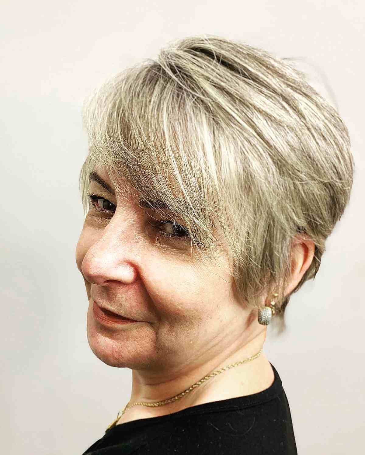 long pixie with side swept bangs for a 60 year old woman