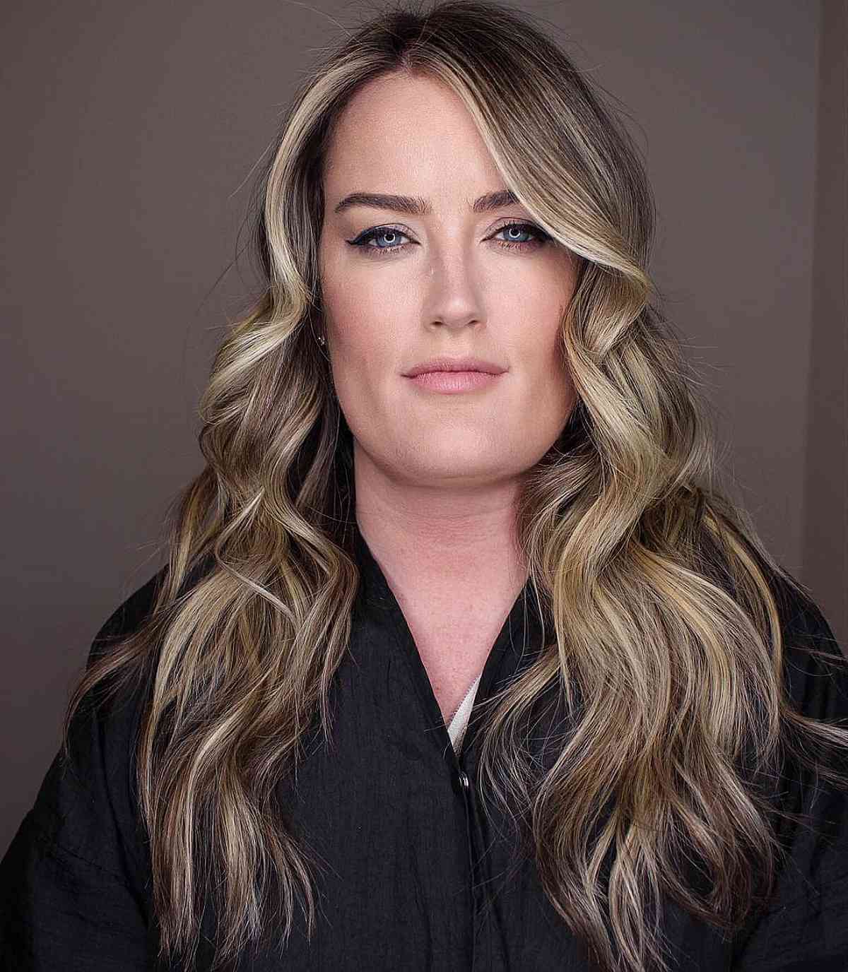 long side parted hair with subtle layers for ladies past forty