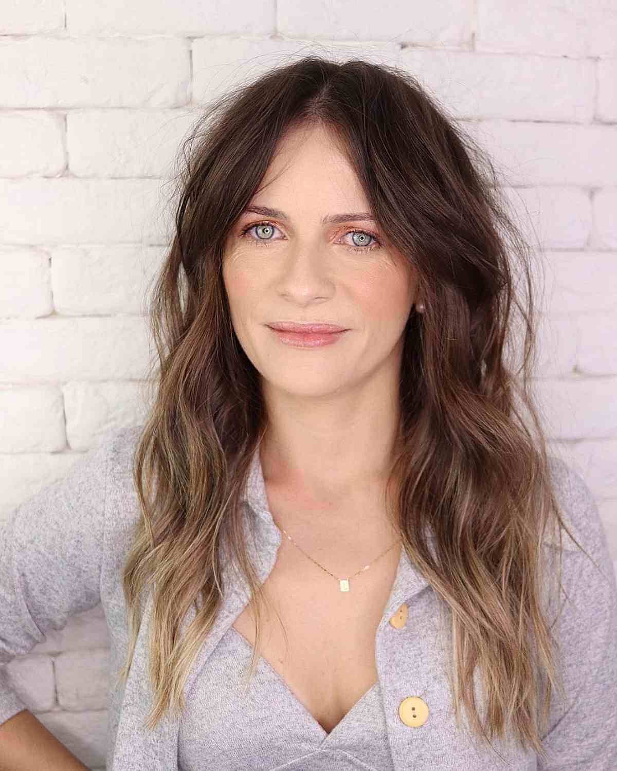 long textured shaggy hair with beach waves for forty year olds