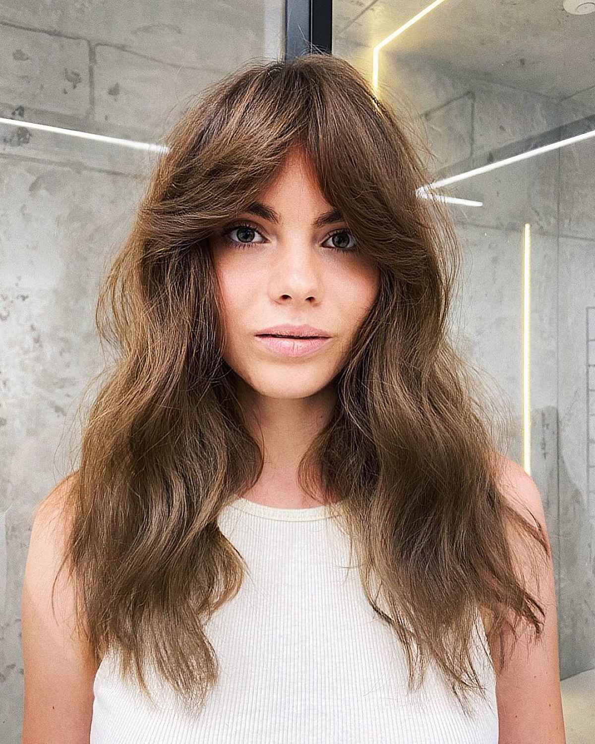 long wavy hair with parted bangs