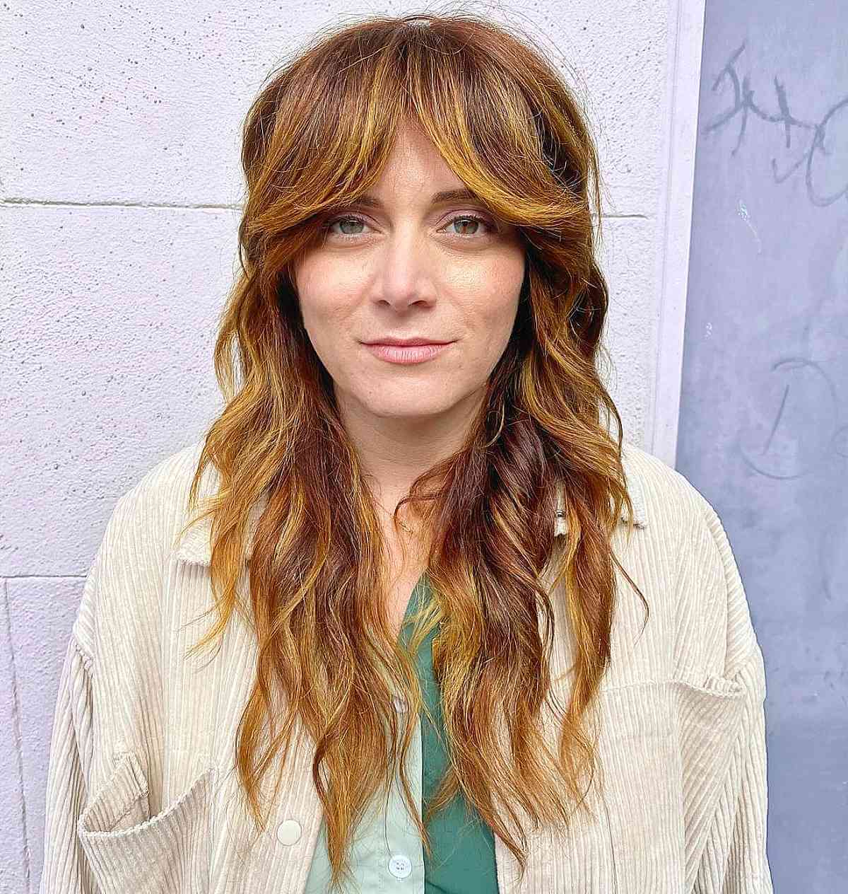 longer shaggy haircut with face framing bangs for forty year old ladies