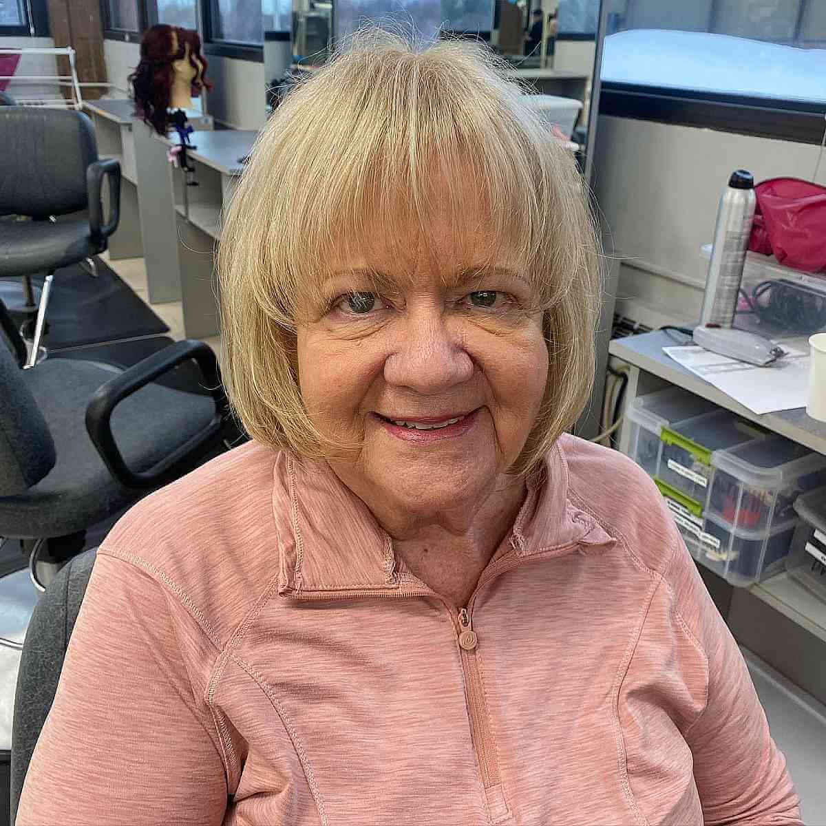 lovely bob with a root retouch and lowlights for 70 year olds