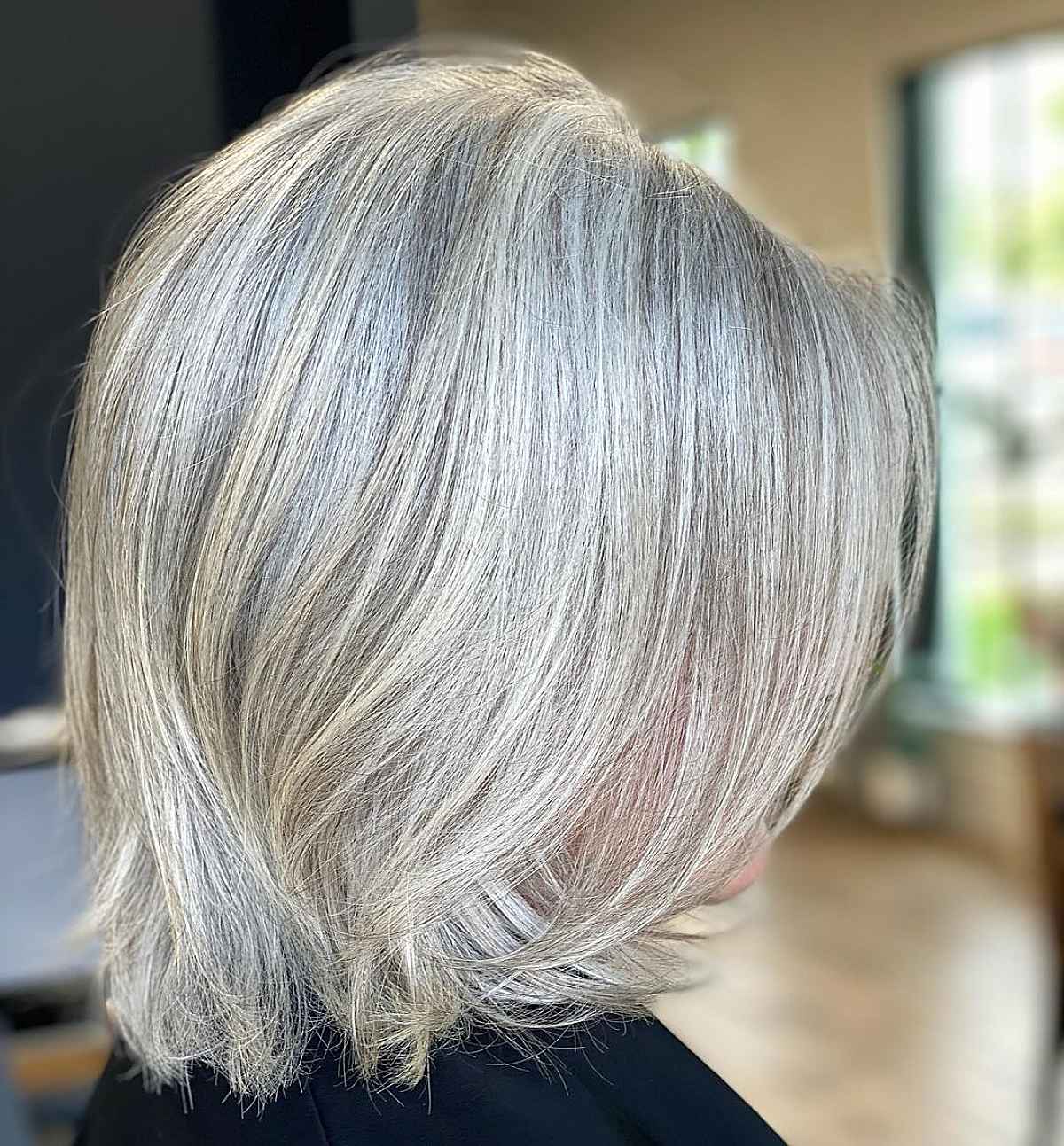 low maintenance layered bob for women aged 60 with silver hair