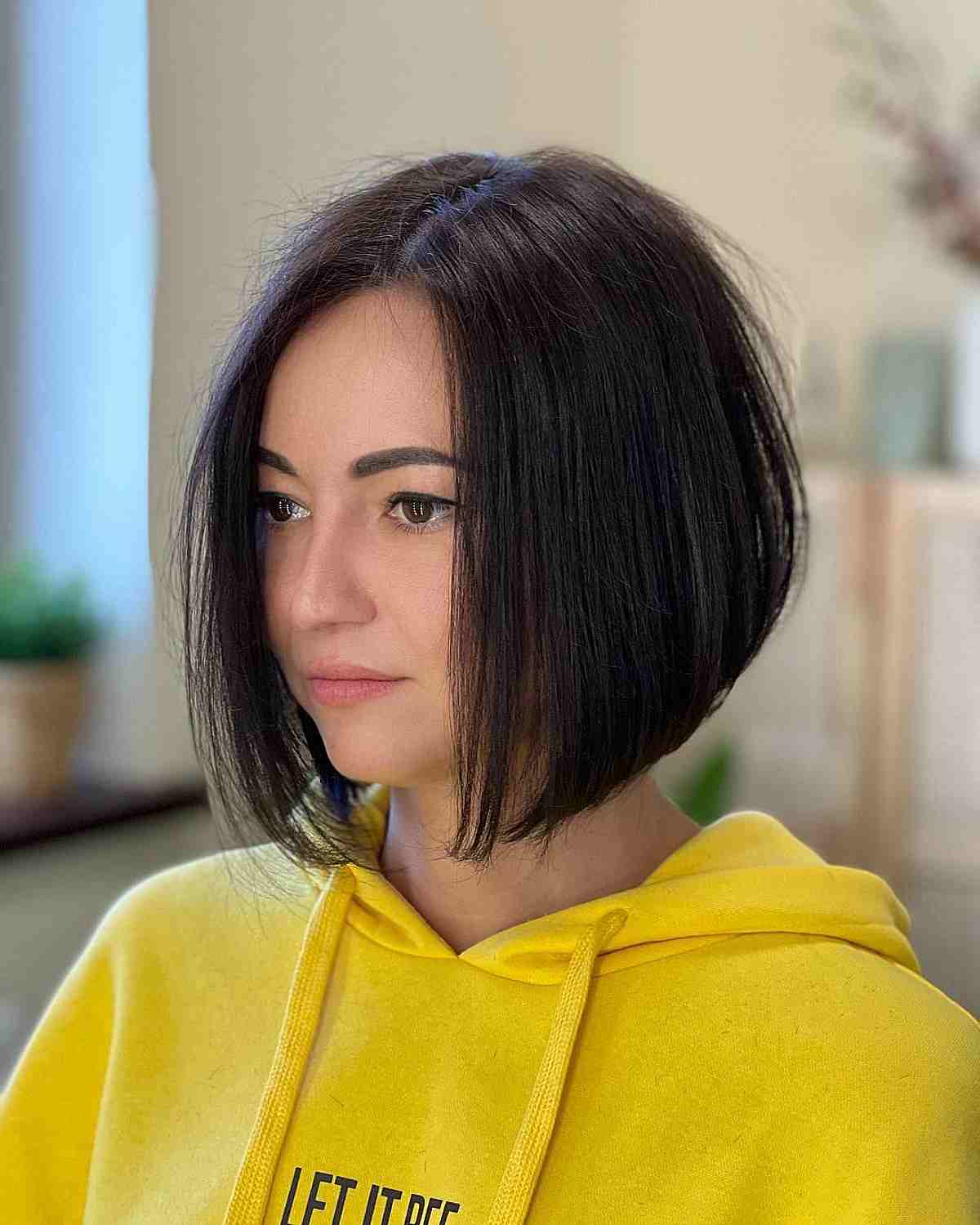 low maintenance neck length short angled bob