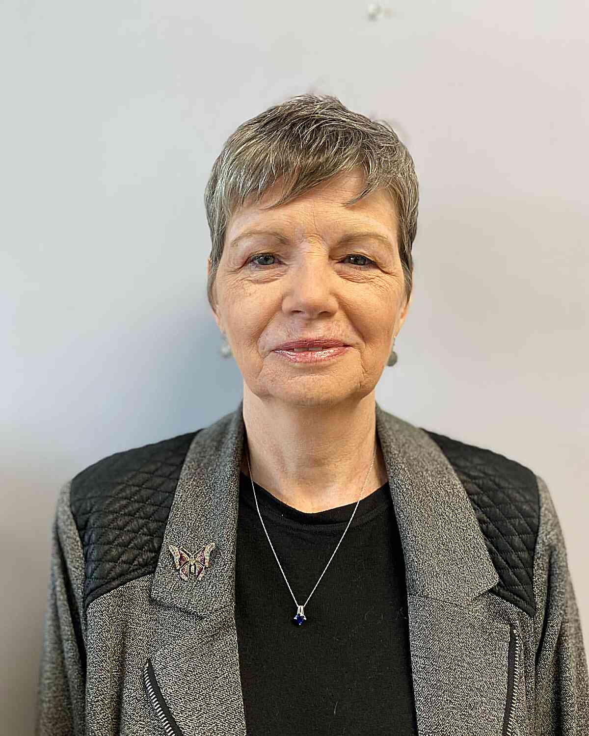 low maintenance razor cut pixie with bangs for older women past 50