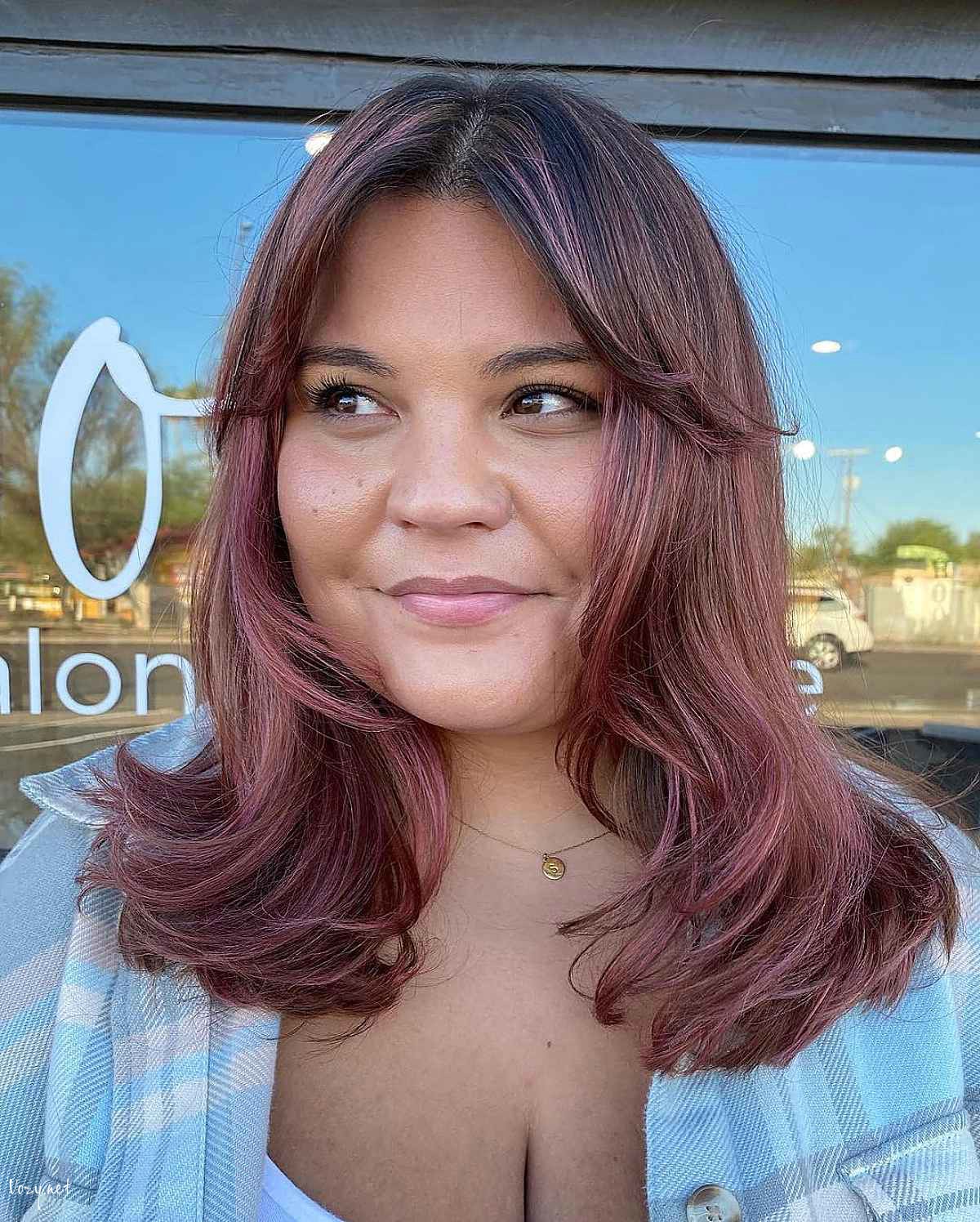 medium haircut with curtain bangs for round faces